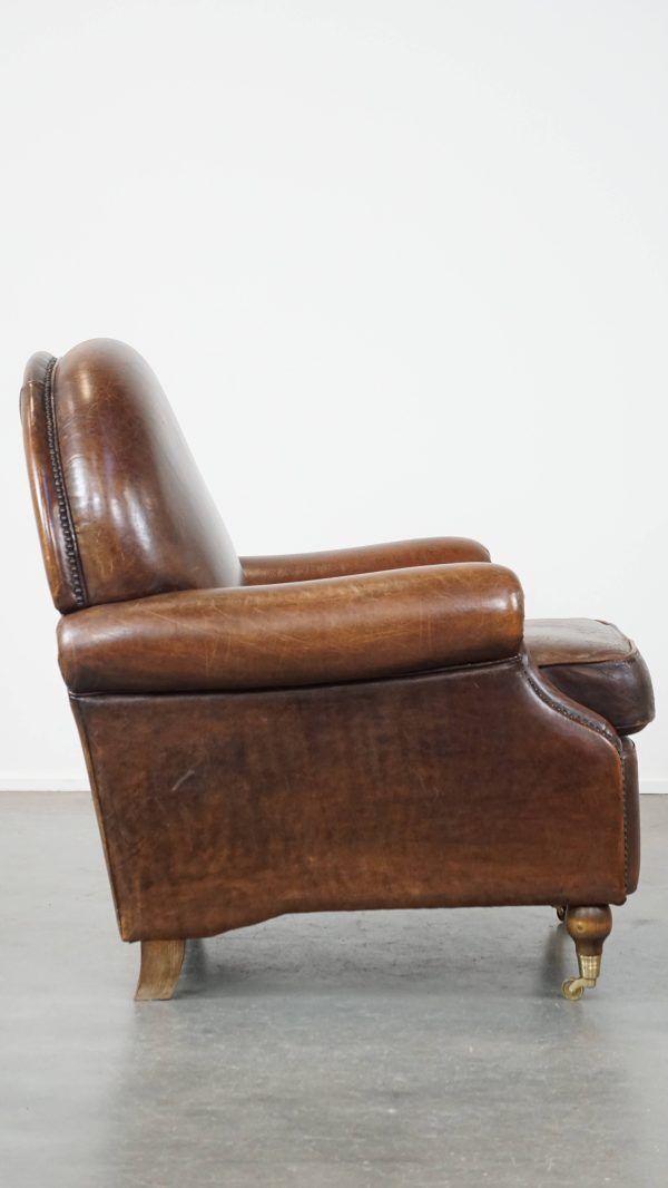 Klassieke Schapenvacht Fauteuil In Donkere Kleur, Goede Staat, Met Ronde Vormen En Op Wieltjes photo furniture