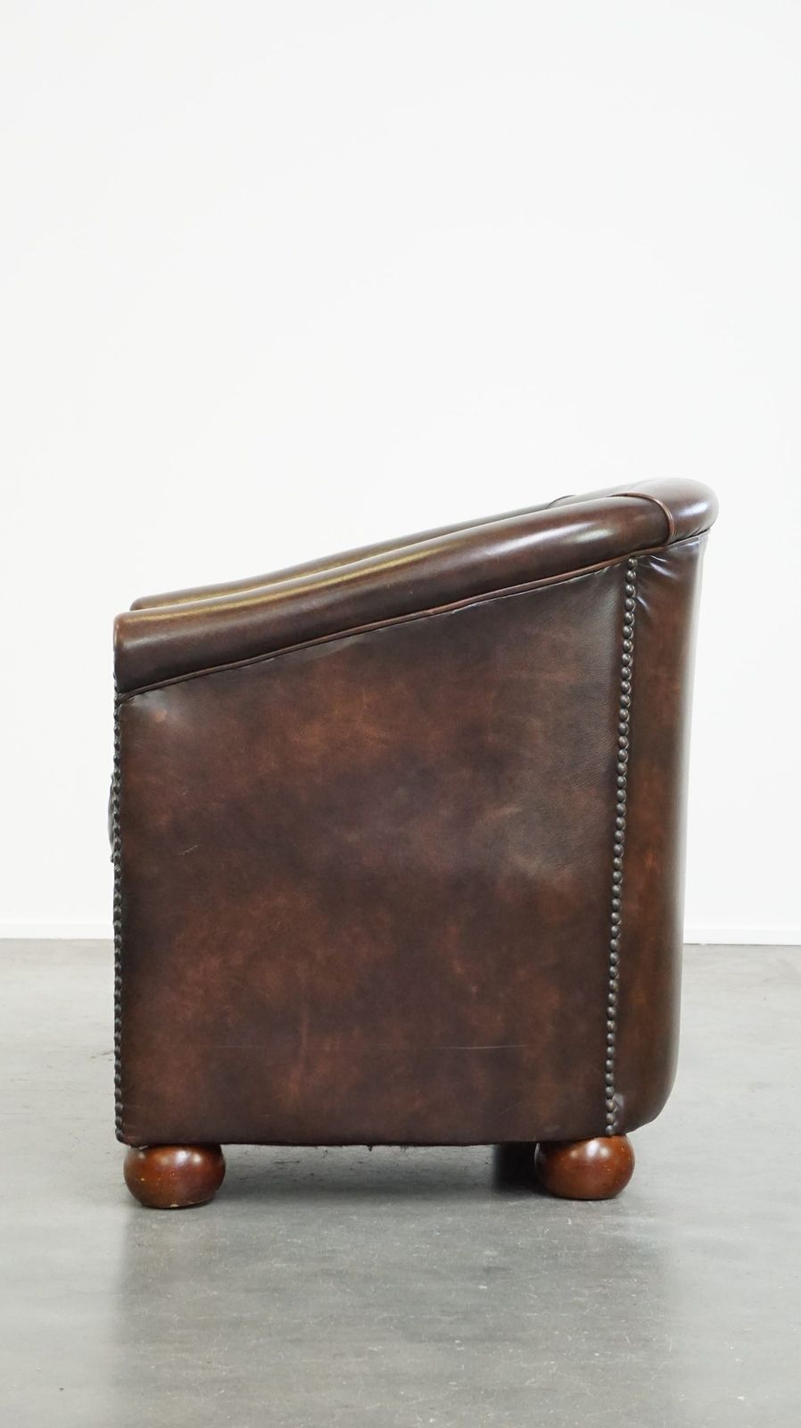 Beautiful Luxurious Dark Cowhide Club Chair With Ball Feet In English Style photo 887.2226999999999
