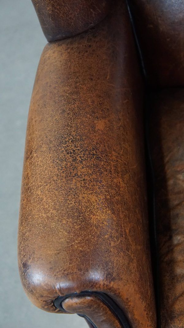 Characteristic And Comfortable Sheepskin Wing Chair With A Beautiful Patina photo buy