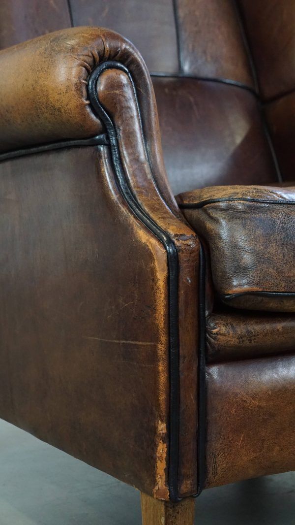 Furniture Characteristic And Comfortable Sheepskin Wing Chair With A Beautiful Patina photo