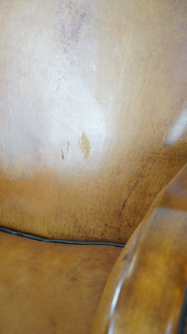 photo for sale Unique, Luxurious Sheepskin Armchair Combined With Wood And Finished With Decorative Nails
