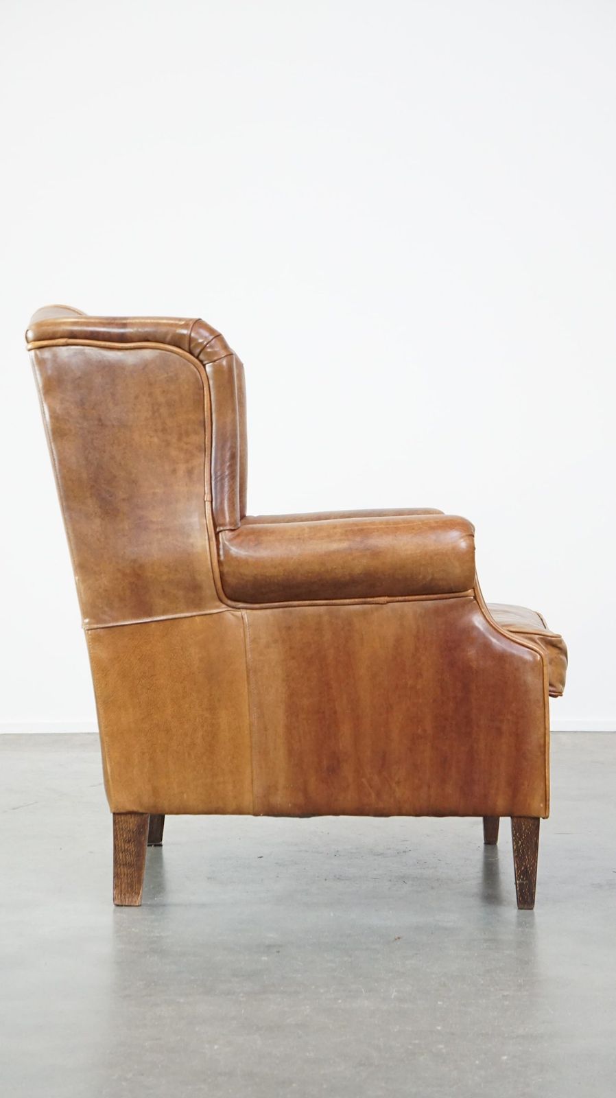 Graceful, Stylish, Timeless And Comfortable Wing Chair Made Of Cowhide In English Style photo for sale