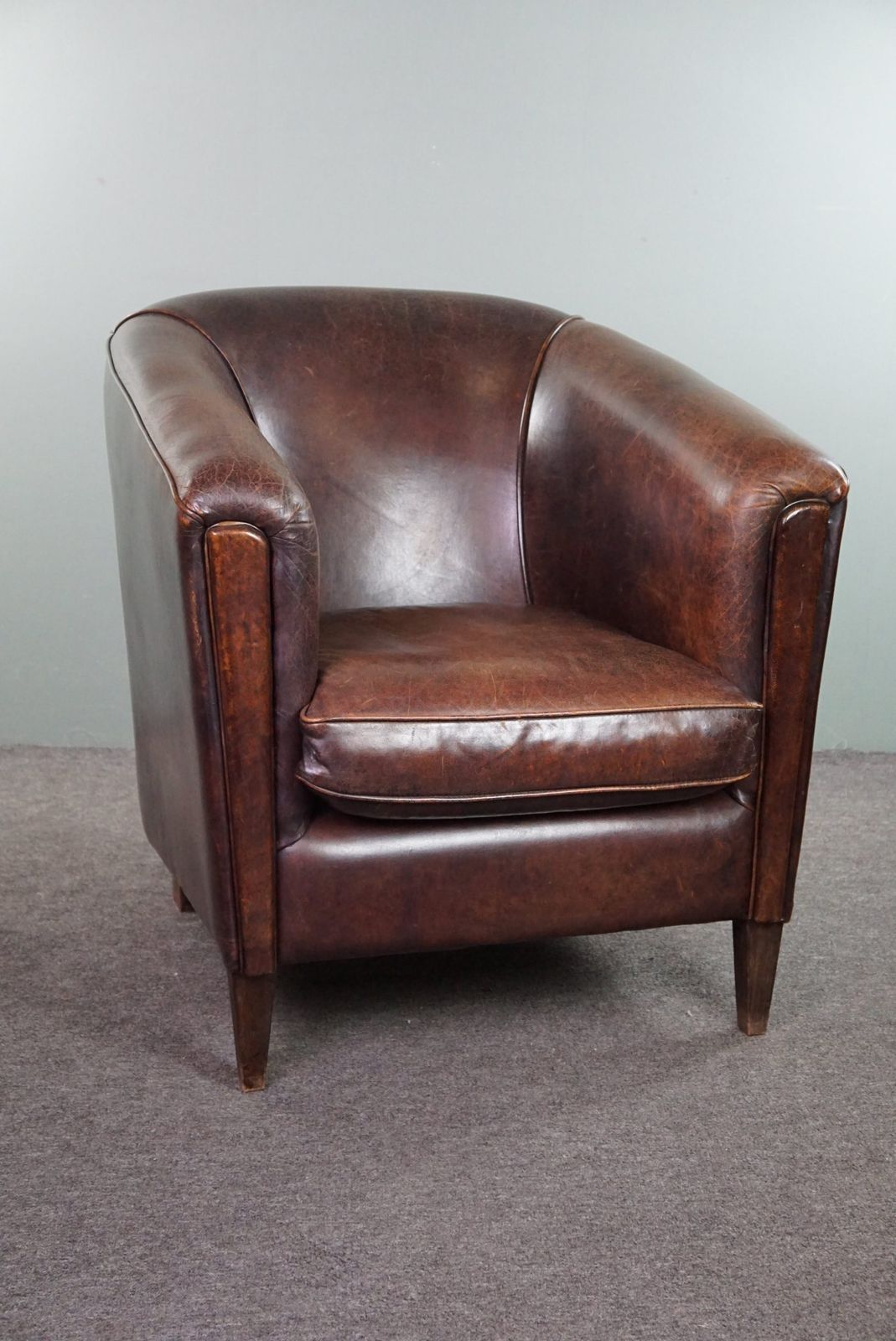 Dark Charming Sheepskin Club Chair With A Sleek Design