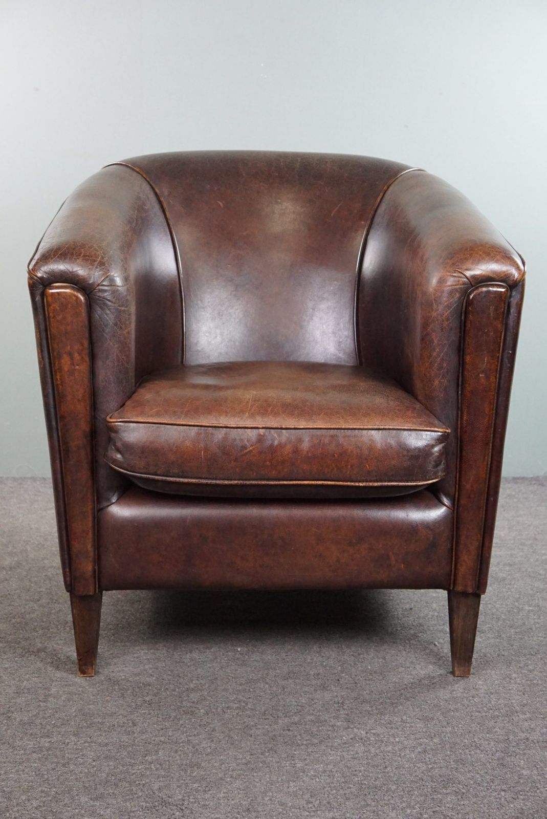 Dark Charming Sheepskin Club Chair With A Sleek Design photo furniture
