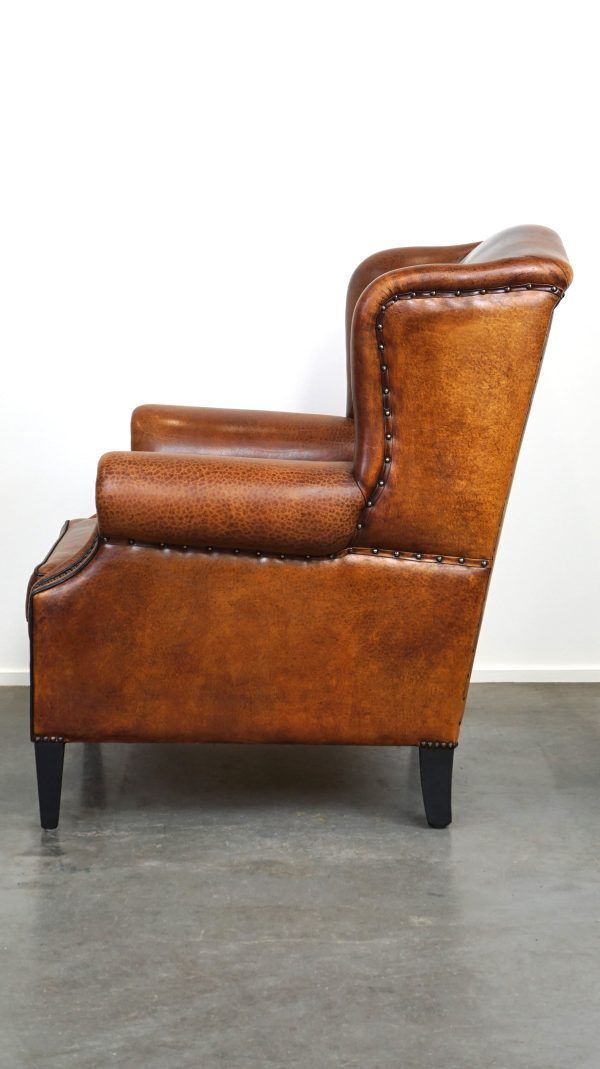 Beautiful Armchair Made Of Very Good Quality Sheepskin Finished With Nails And Black Piping photo buy