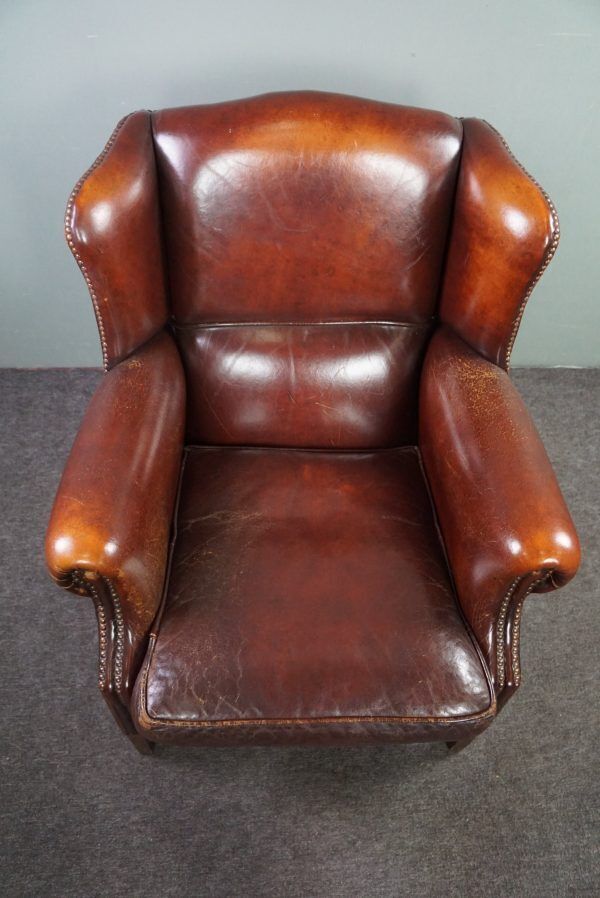 Warm Brown Sheepskin Wing Chair With Character photo vinterior