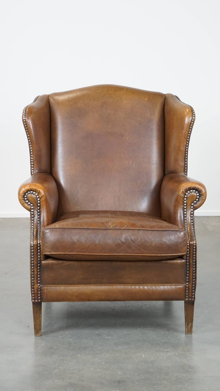 Charming, Subtle English Style Sheepskin Wing Chair With Beautiful Colours And Excellent Seating Comfort photo furniture