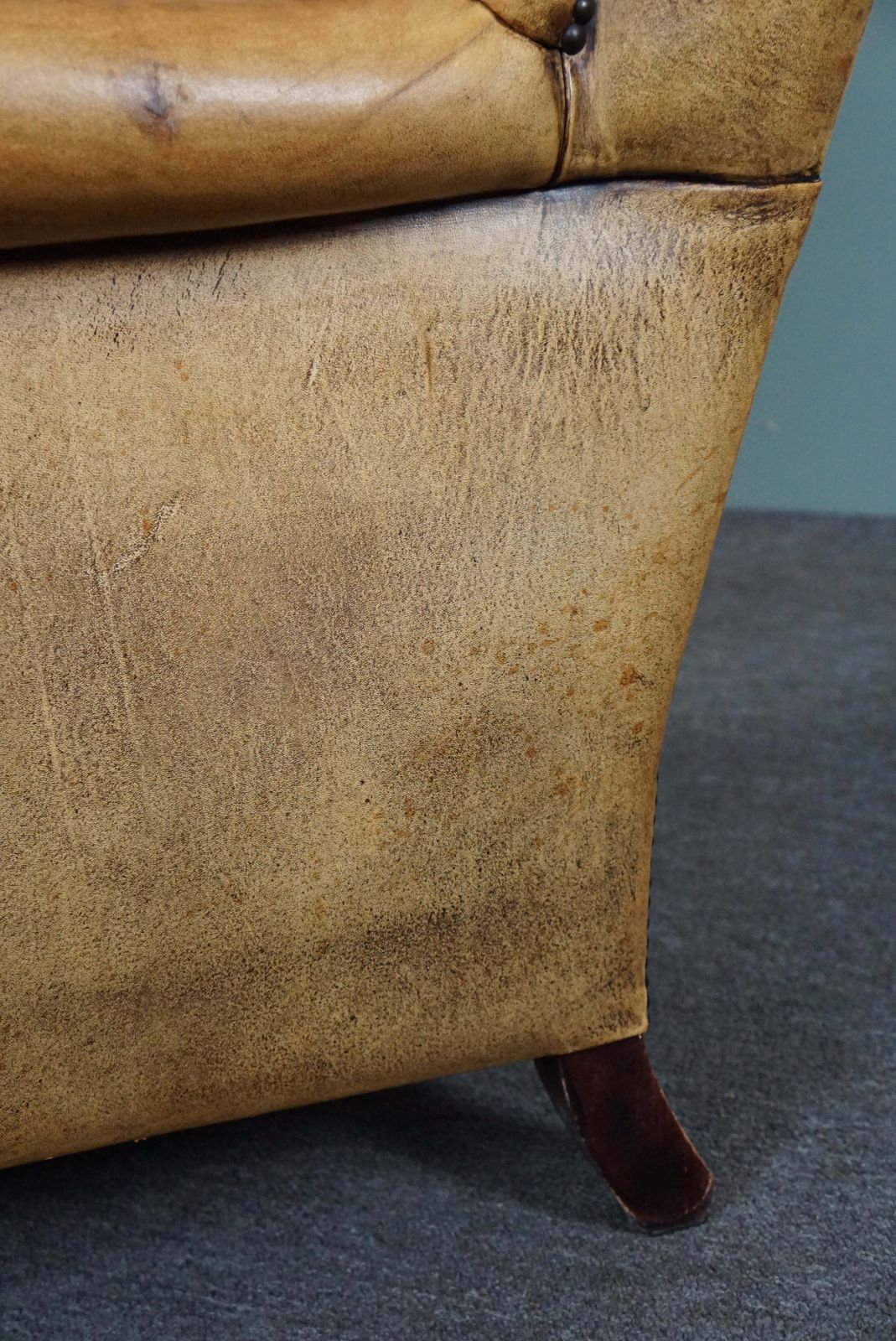 photo furniture Expressive Cognac Colored Sheepskin Wing Chair