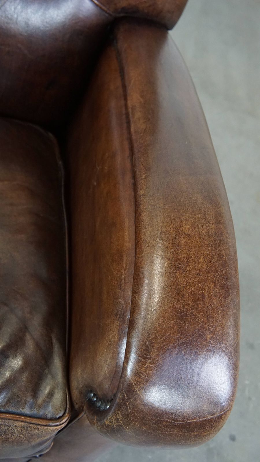 Royal And In Good Condition Dark Sheepskin Armchair With Round Shapes And A Comfortable Seat photo vintage