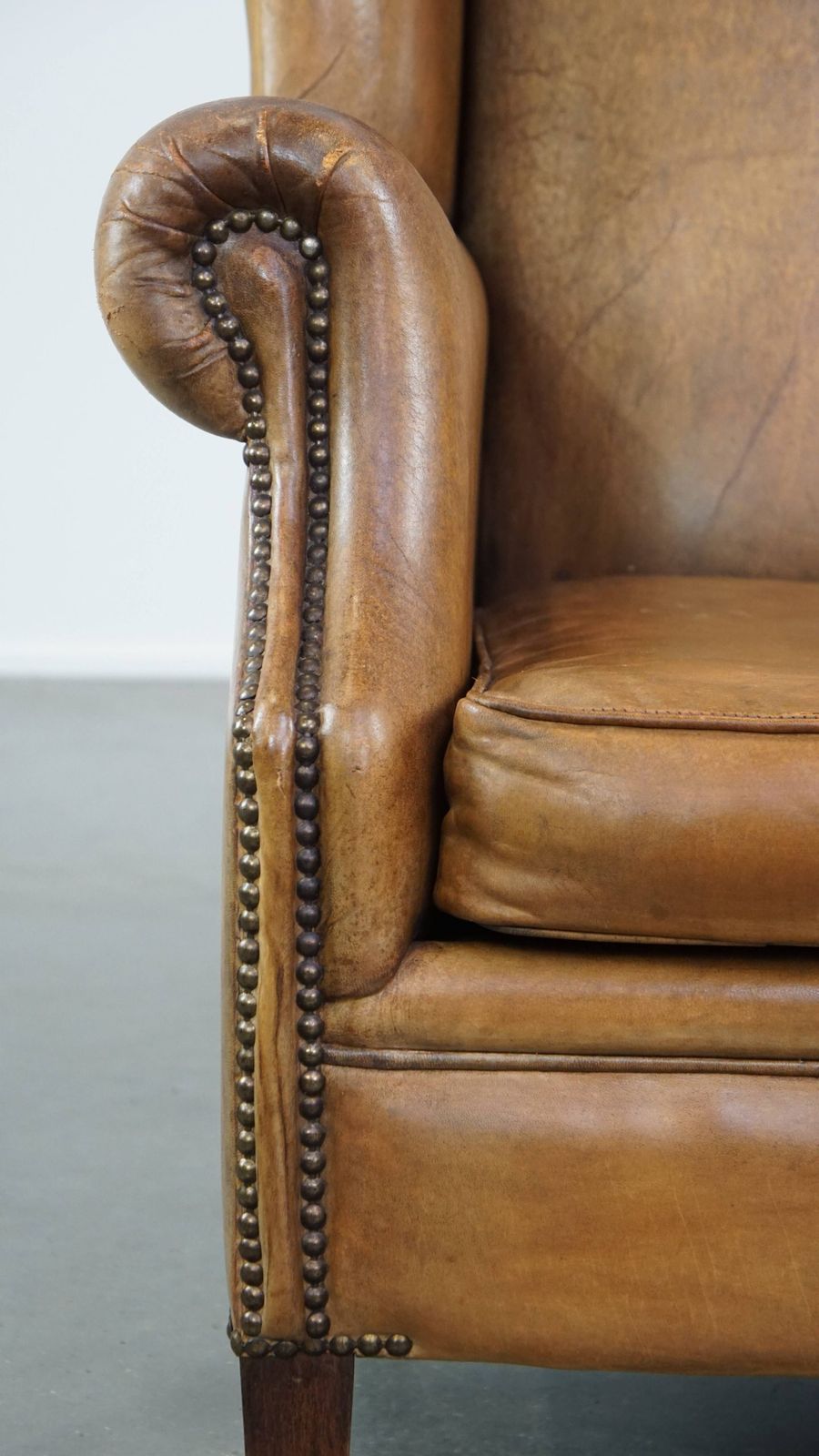 Furniture Beautiful Sheepskin Wing Chair With A Very Nice Color And Patina photo