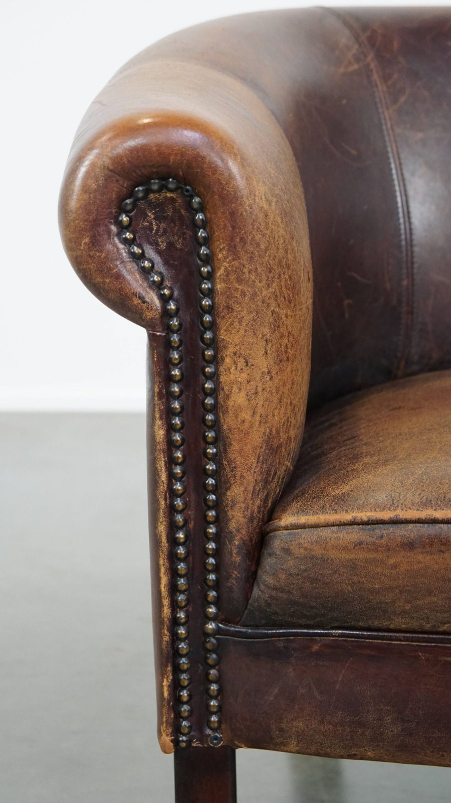 photo for sale Subtle Sheepskin Club Chair With A Robust Appearance And Neatly Finished With Decorative Nails