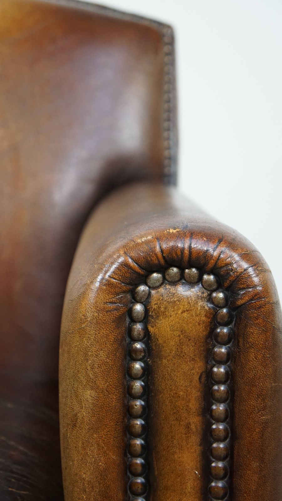 Furniture Charming And Characteristic Subtle Patinated Sheepskin Armchair With A Wonderful Patina photo