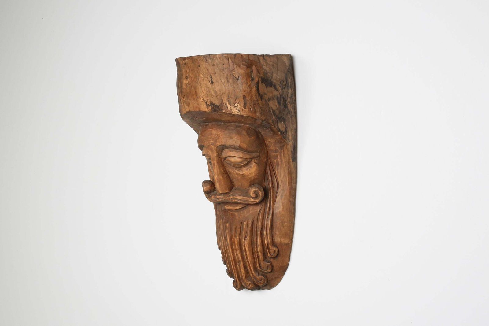 Hand Carved Rustic Wooden Mask With Soft Expression photo furniture