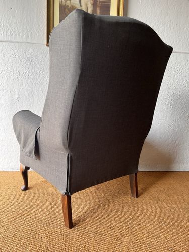 Large Comfortable Antique Wingback Chair With Clean Grey Coloured Loose Covers photo vinterior