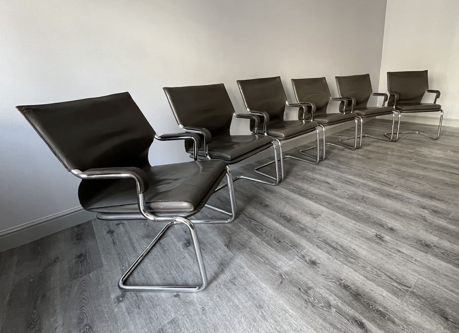 photo furniture Set Of 6 Iconic Uno Chairs In Hand Stitched Heavy Grey Leather On Tubular Chrome Metal Cantilevered Frames.