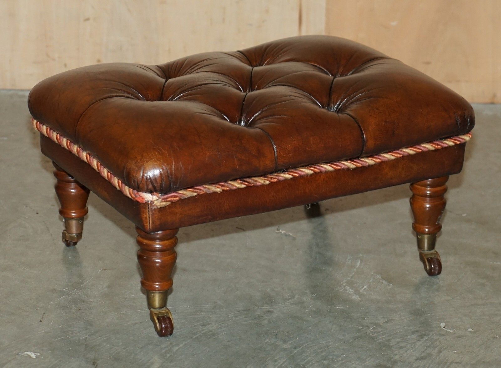 2950.0 Pair Of Restored Brown Leather Chesterfield Tufted Porcelain Castors Footstools photo