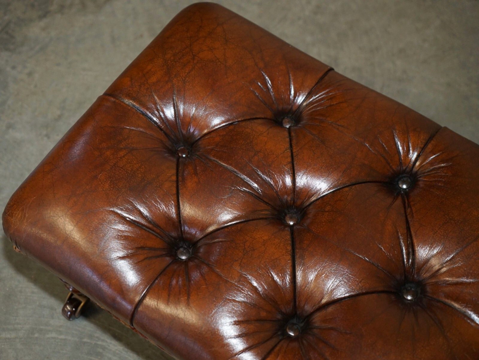 photo vintage Pair Of Restored Brown Leather Chesterfield Tufted Porcelain Castors Footstools