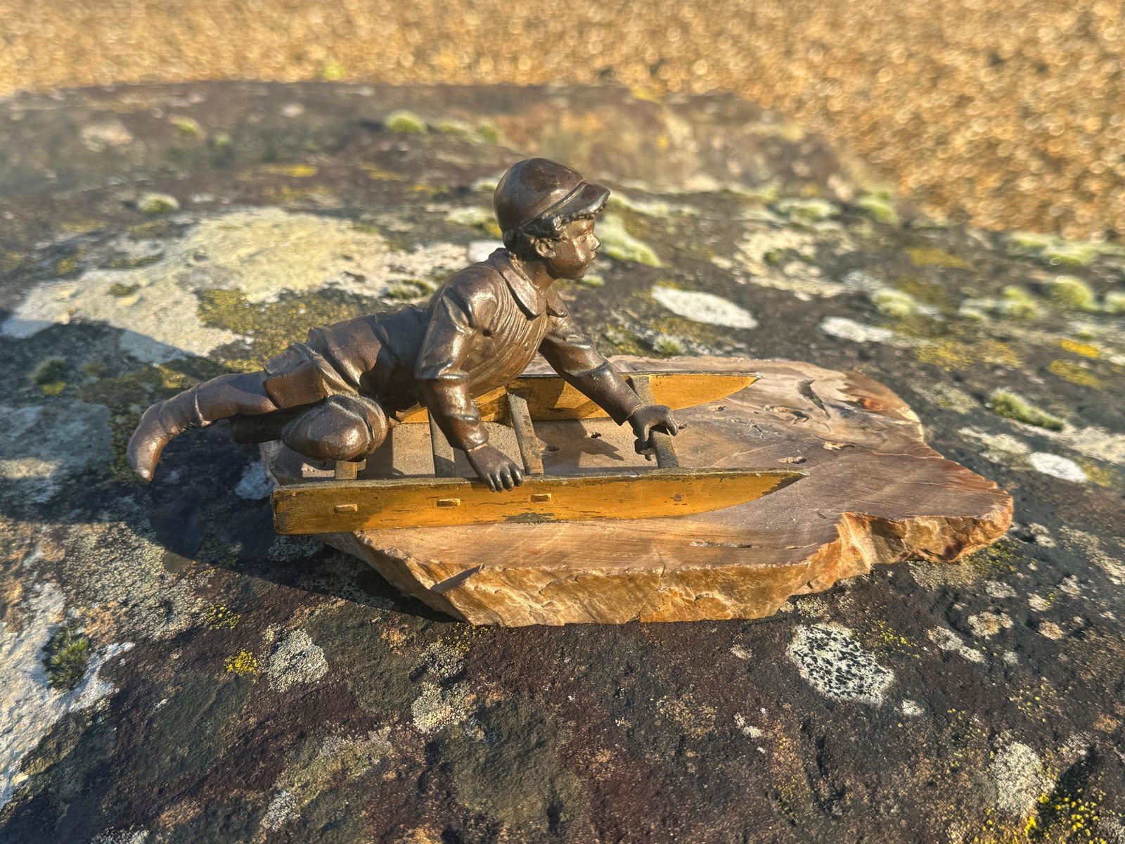 An Early 20th Century French Bronze Figure Of A Young Boy On A Toboggan photo for sale