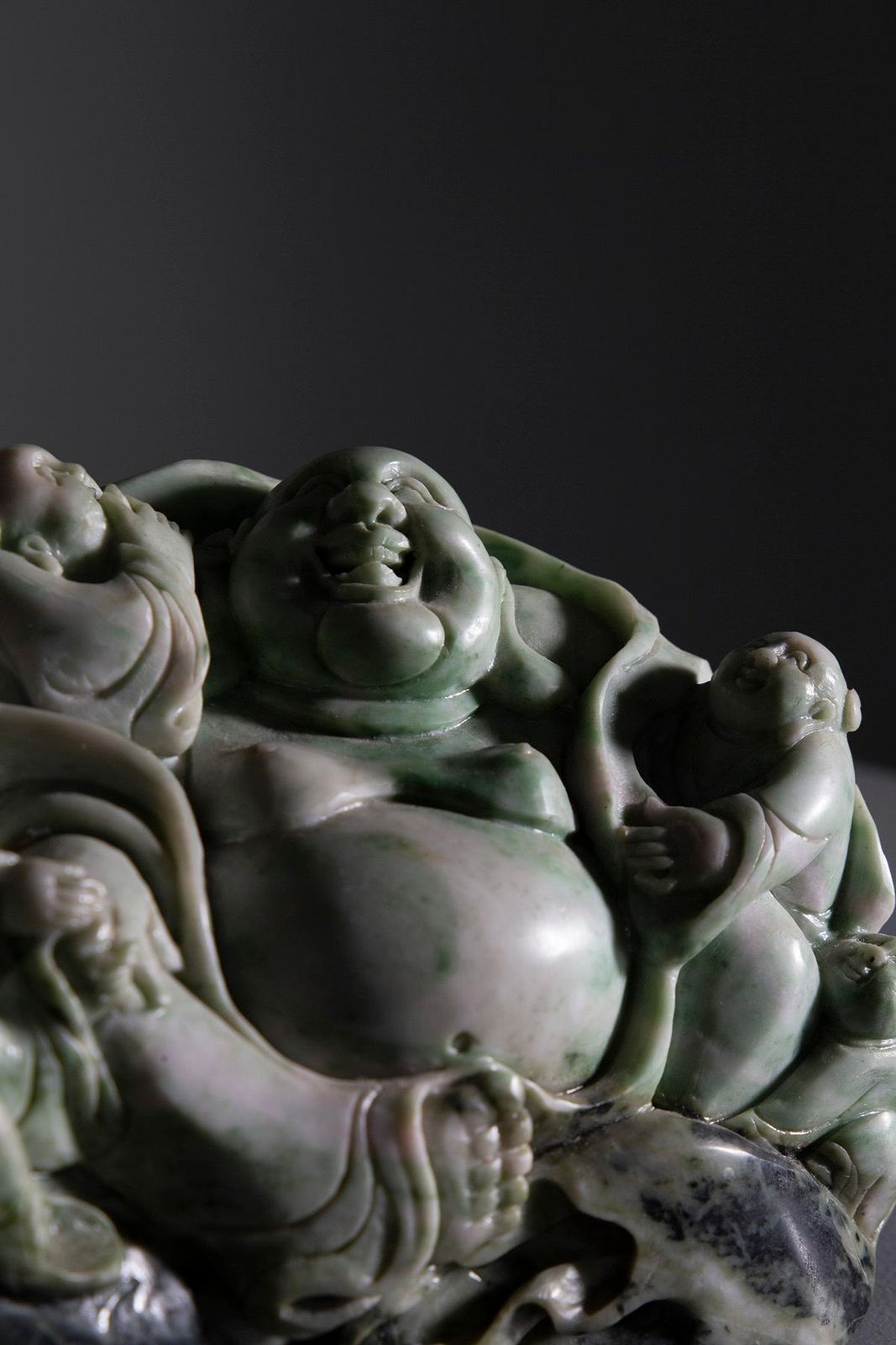 Sculpture Of Buddha Surrounded By Children In Jade Root photo vintage
