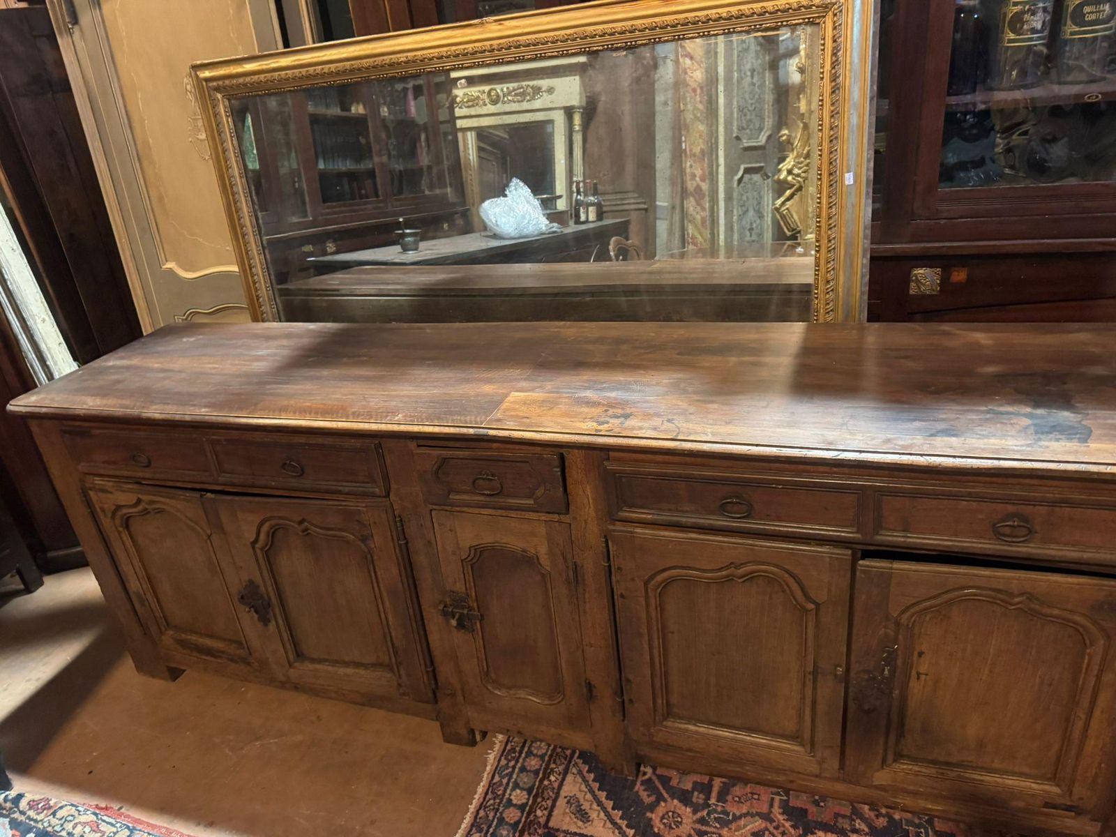 Low Sideboard In Walnut Wood, Five Carved Panel Doors And Five Drawers, France photo for sale