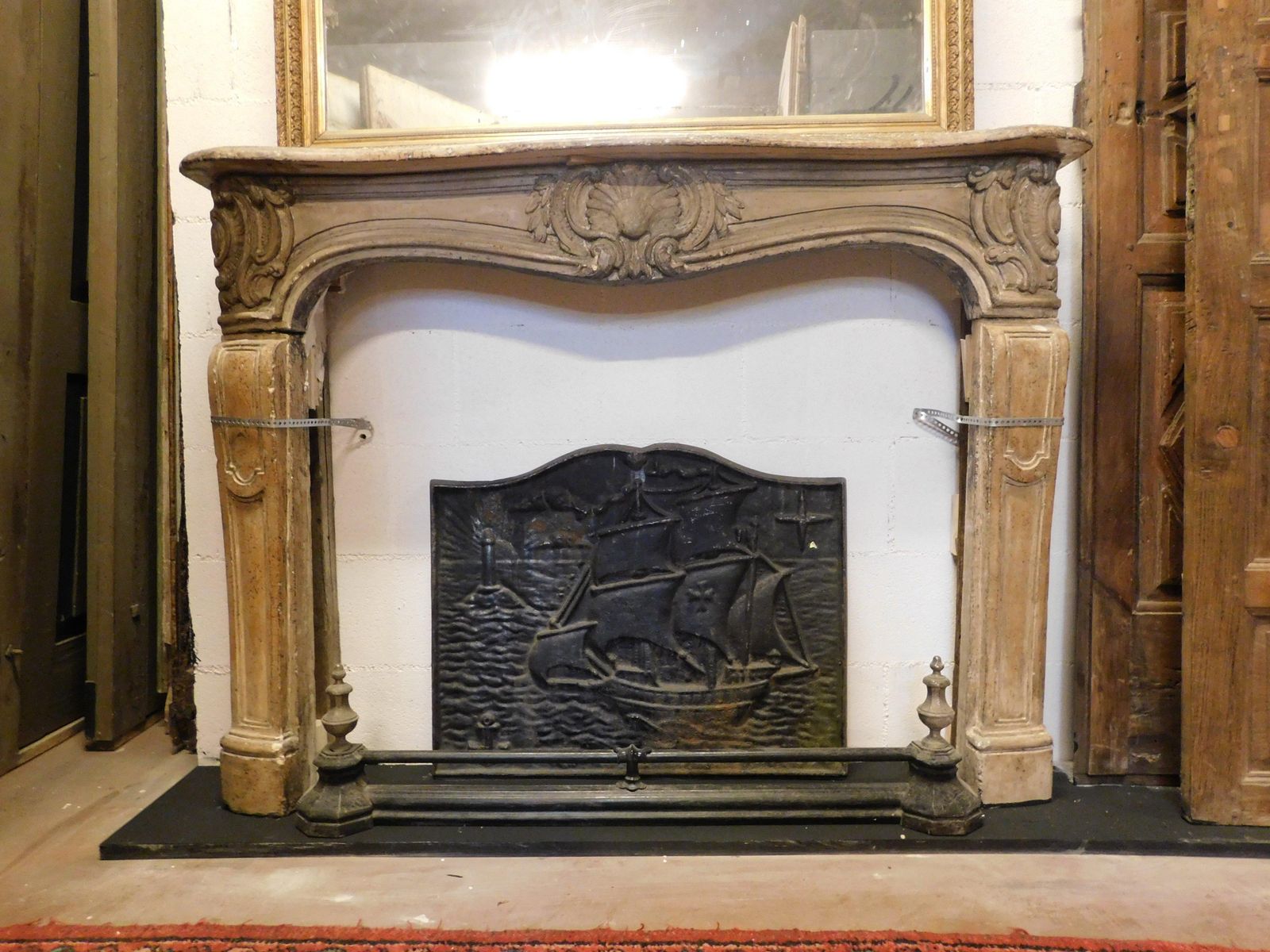Fireplace Mantle In Carved Burgundy Stone, France photo Home Fixtures