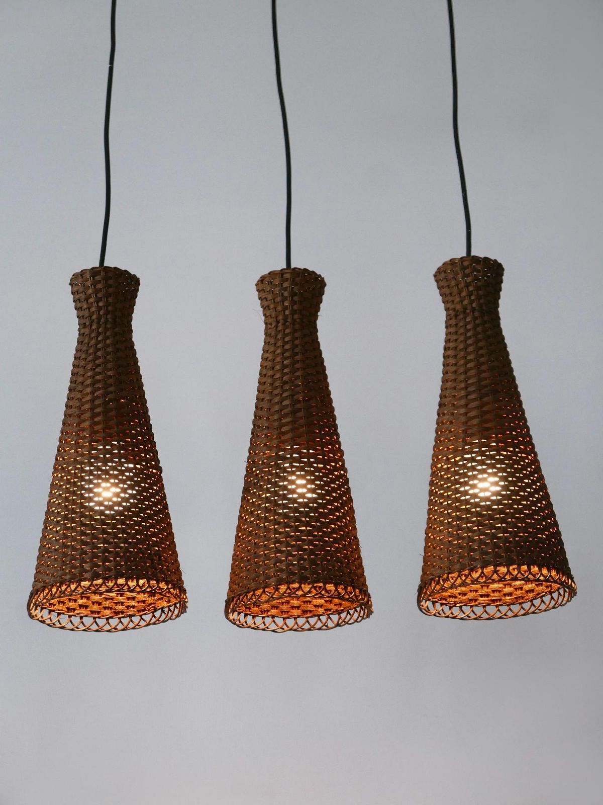 photo for sale Set Of Three Lovely Mid Century Modern Rattan Diabolo Pendant Lamps 1960s