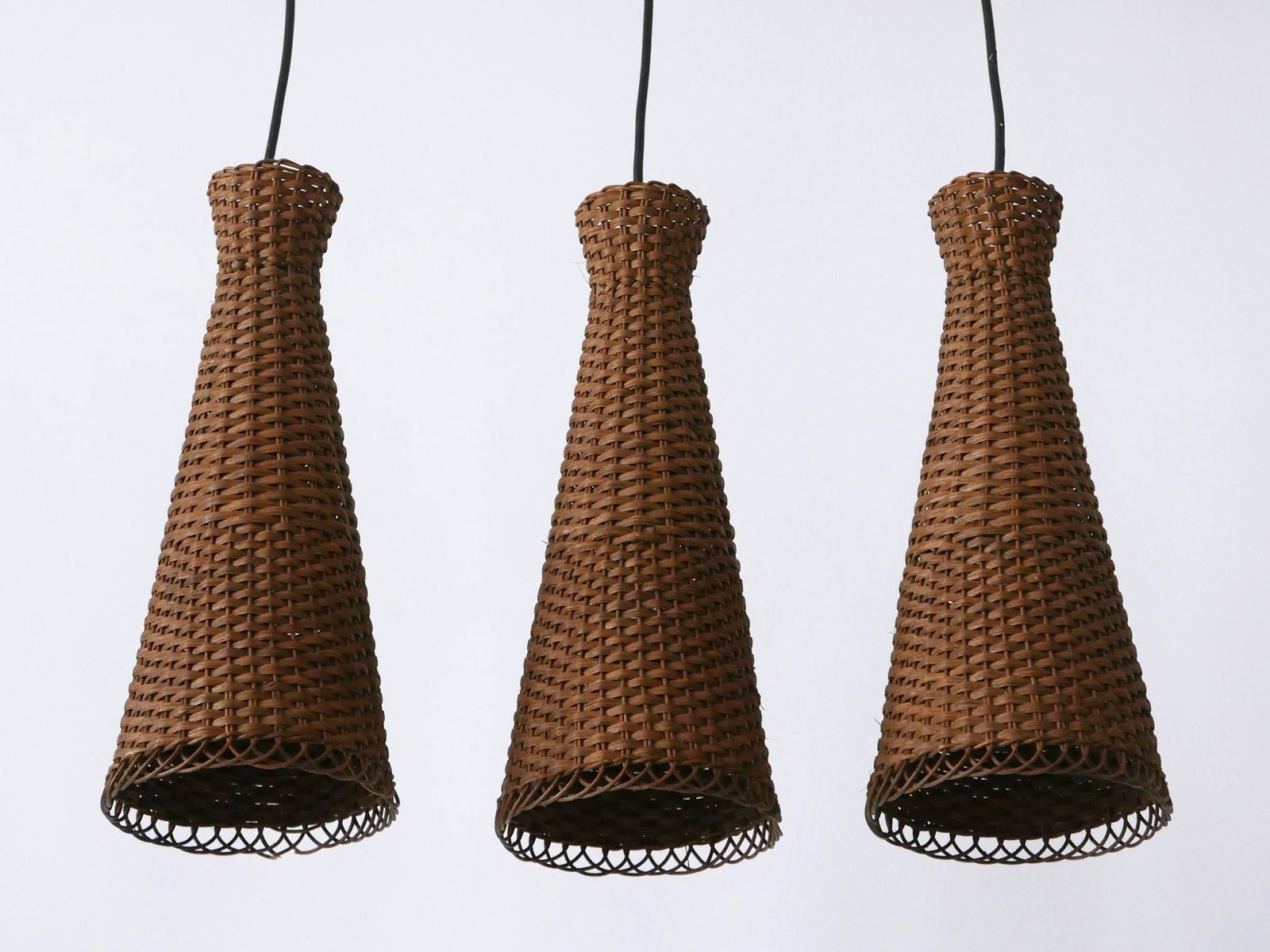 photo vintage Set Of Three Lovely Mid Century Modern Rattan Diabolo Pendant Lamps 1960s