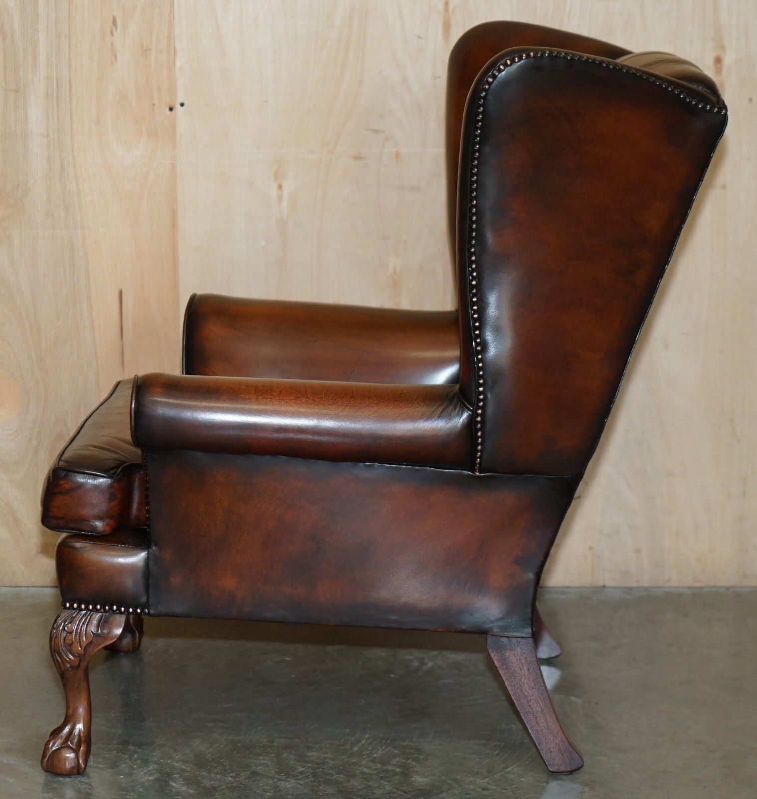 photo vintage Pair Of Claw & Ball Feet Chesterfield Tufted Brown Leather Wingback Armchairs