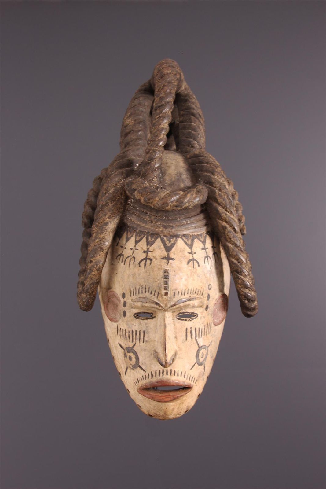 photo for sale African Wooden Female Igbo Agbogo Tribal Mask Brown Red Beige Nigeria 1970s