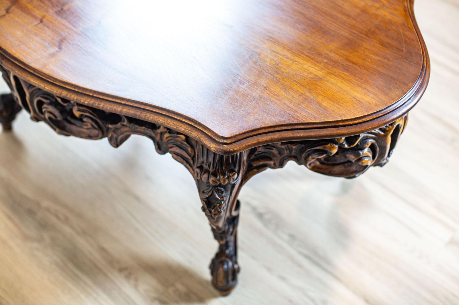 photo furniture Decorative Brown Coffee Table From The Mid 20th Century With Carved Apron