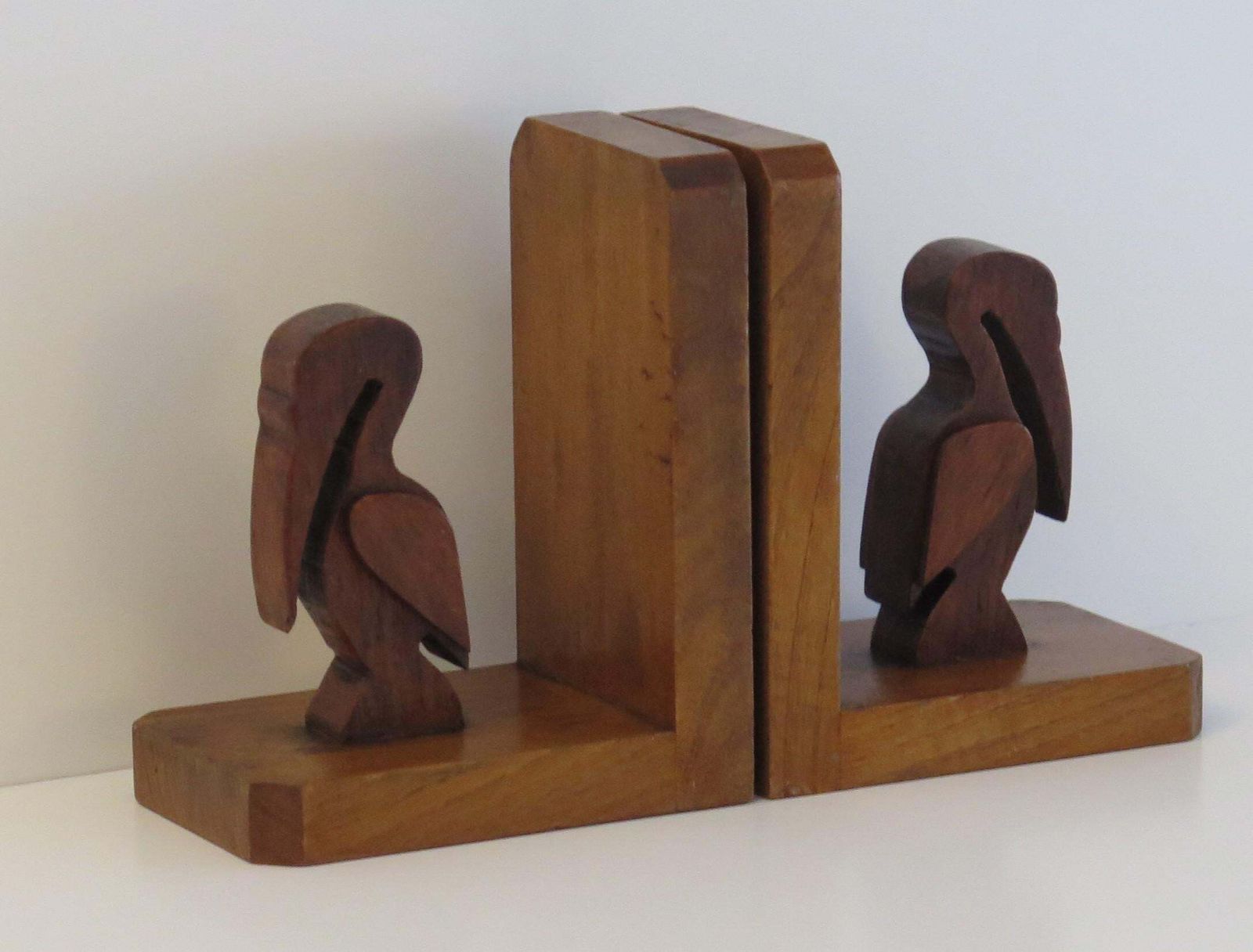 Art Deco Pair Of Pelican Figure Bookends In Hand Carved Woods, Circa 1930 photo for sale