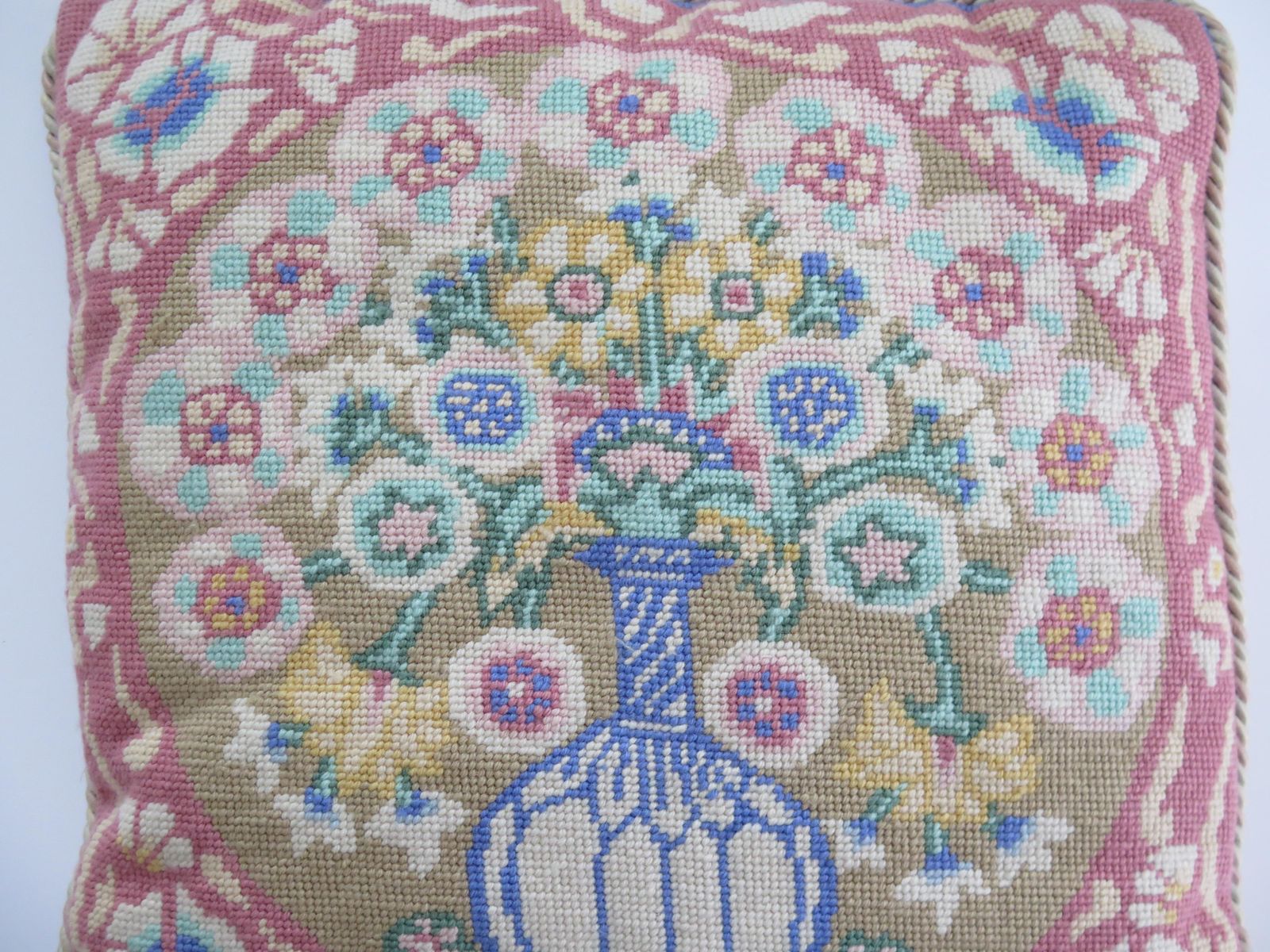 photo for sale Woven Cushion Or Pillow With Flower Vase Pattern In Pastel Shades, Circa 1930s