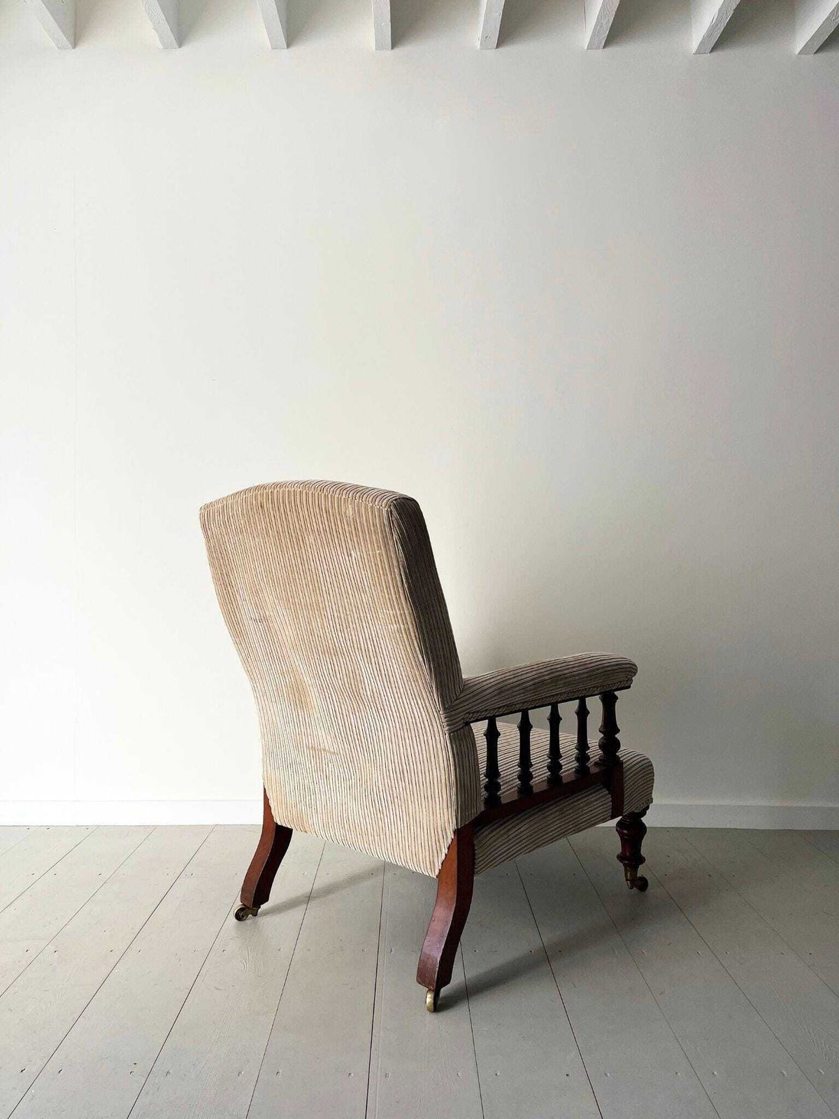 photo furniture Antique Armchair Howard Style Open Arm Upholstered Gentleman's Chair 19th Century Neutral Beige Cord Fabric And Turned Legs & Brass Castors