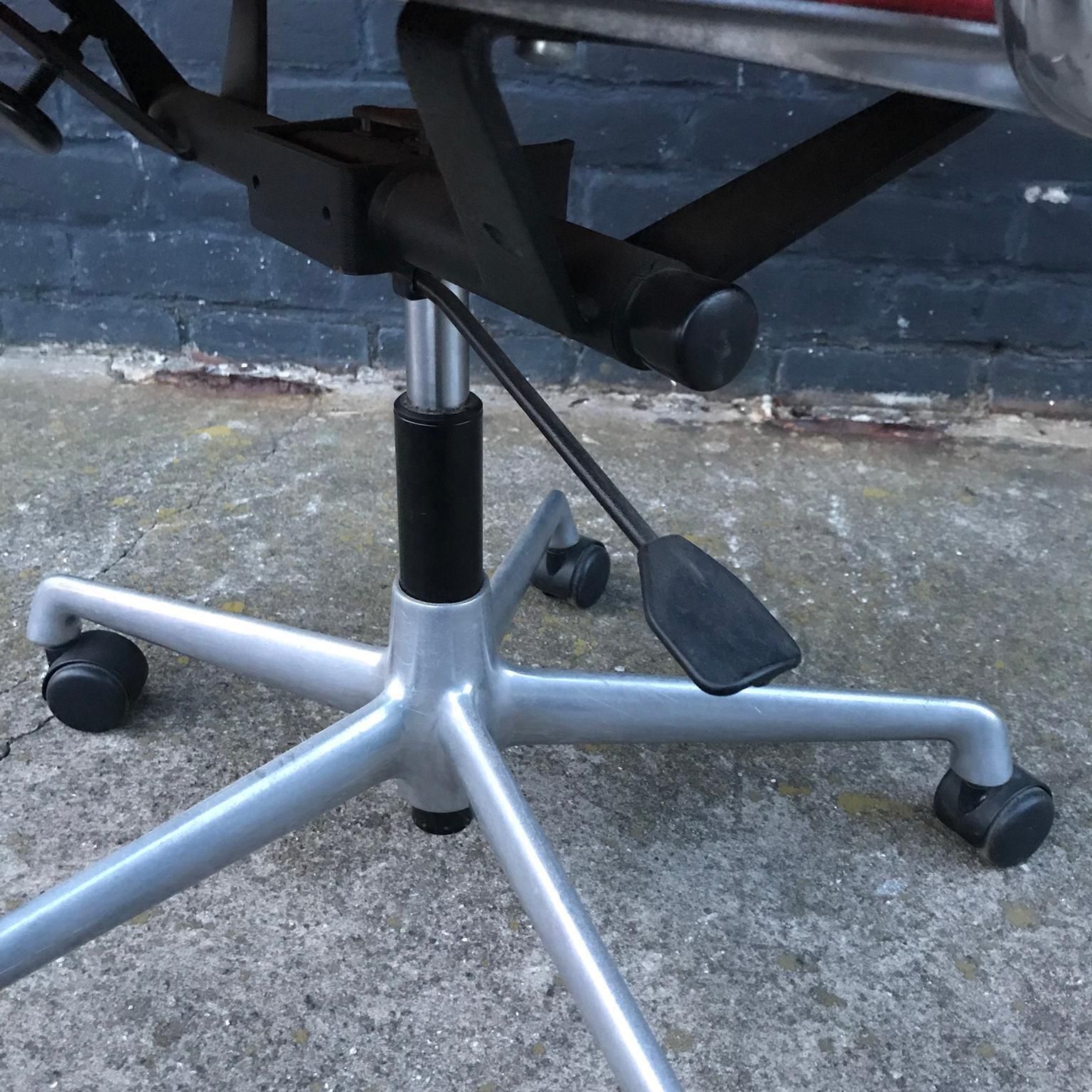 1958, Ray And Charles Eames Red Adjustable Tilt Office Chair With Five Wheels photo vintage