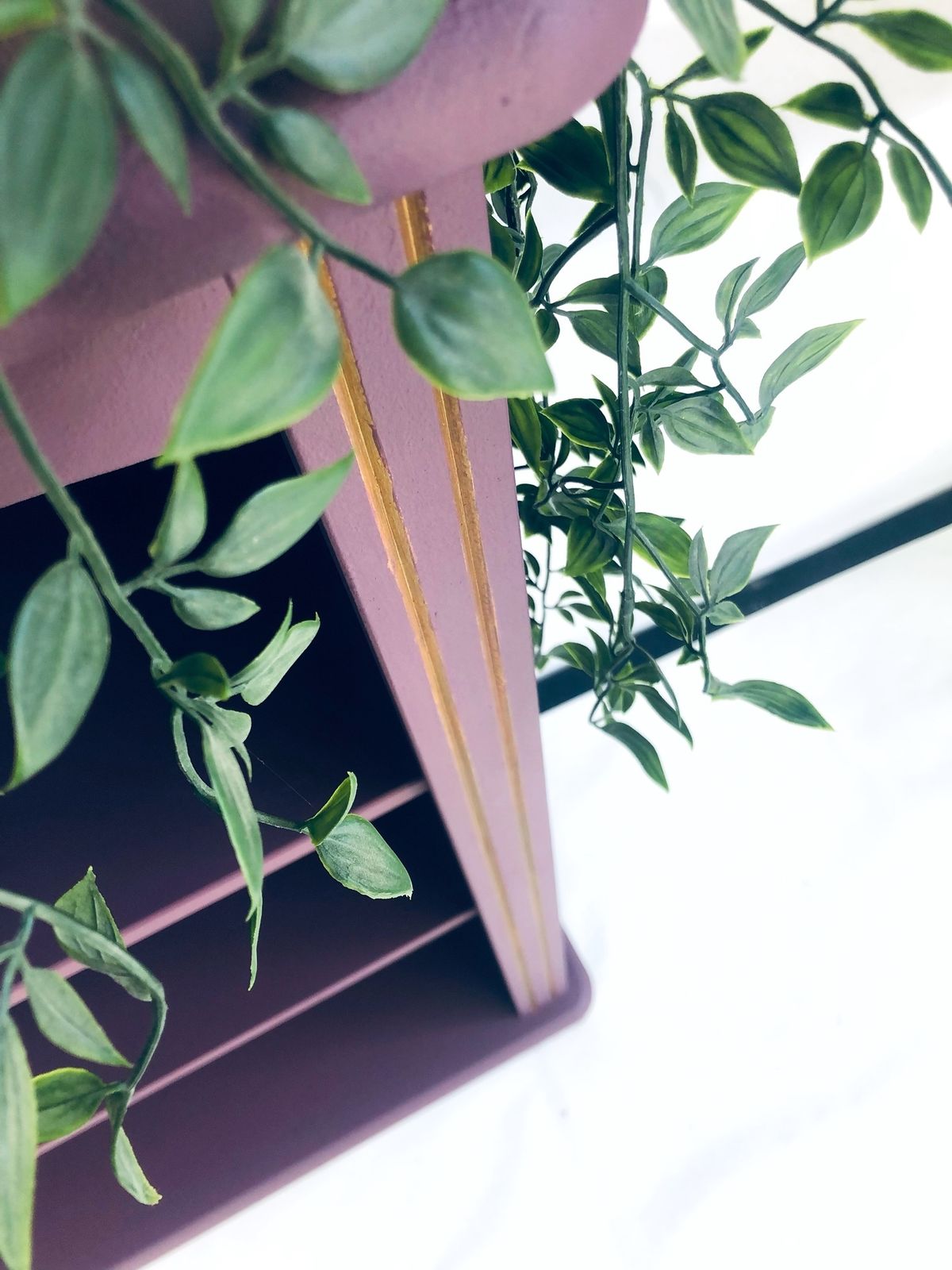 Painted Purple Bookshelf With Gold Trim Detail photo vinterior