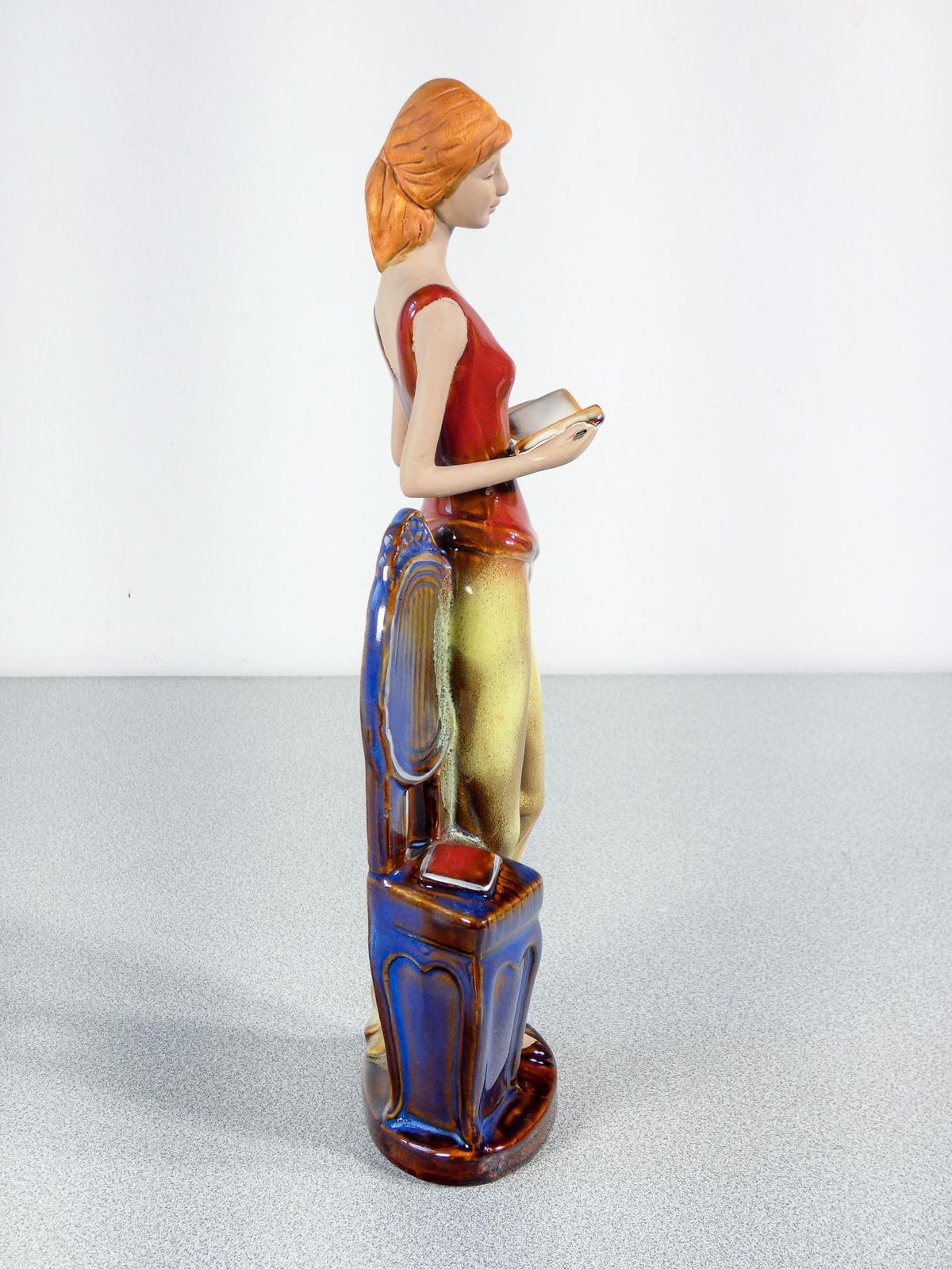 photo furniture Painted And Glazed Ceramic Sculpture. Woman With Books. Italy