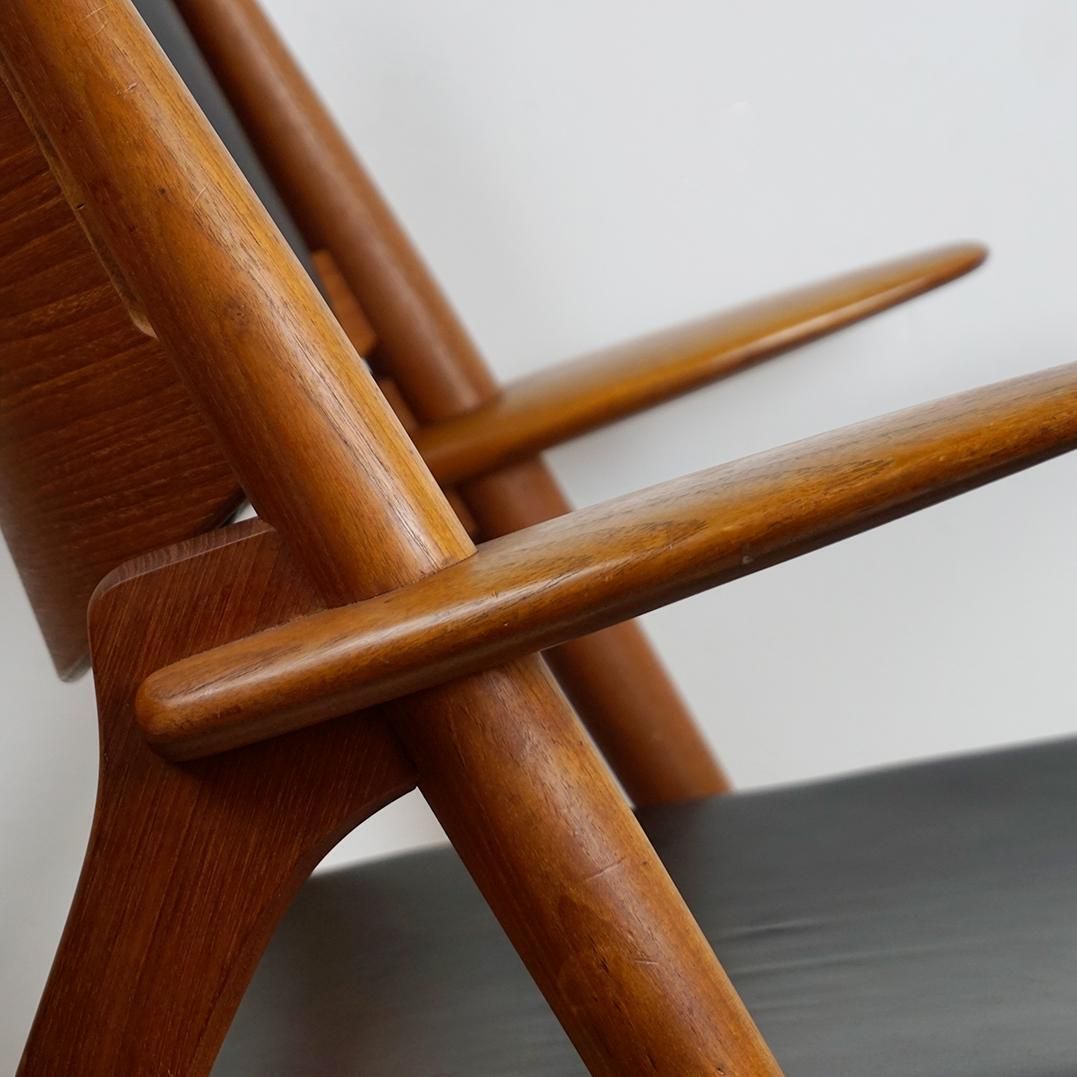 Scandinavian Teak And Black Leather Ch28 Chair By Hans Wegner For Carl Hansen photo vinterior