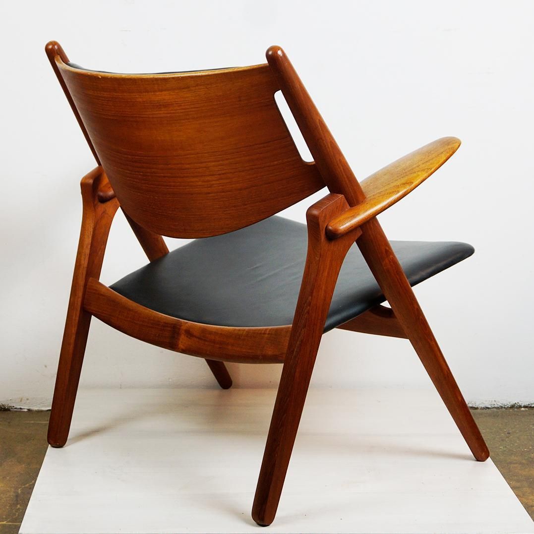 Scandinavian Teak And Black Leather Ch28 Chair By Hans Wegner For Carl Hansen photo buy