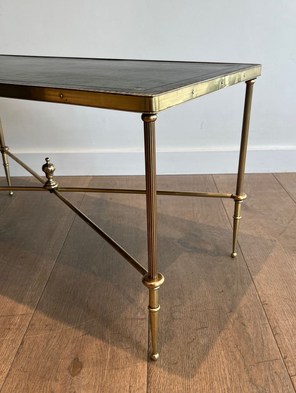 photo vintage Neoclassical Style Brass Coffee Table With Black Leather Top And Gold Trim From Maison Jansen