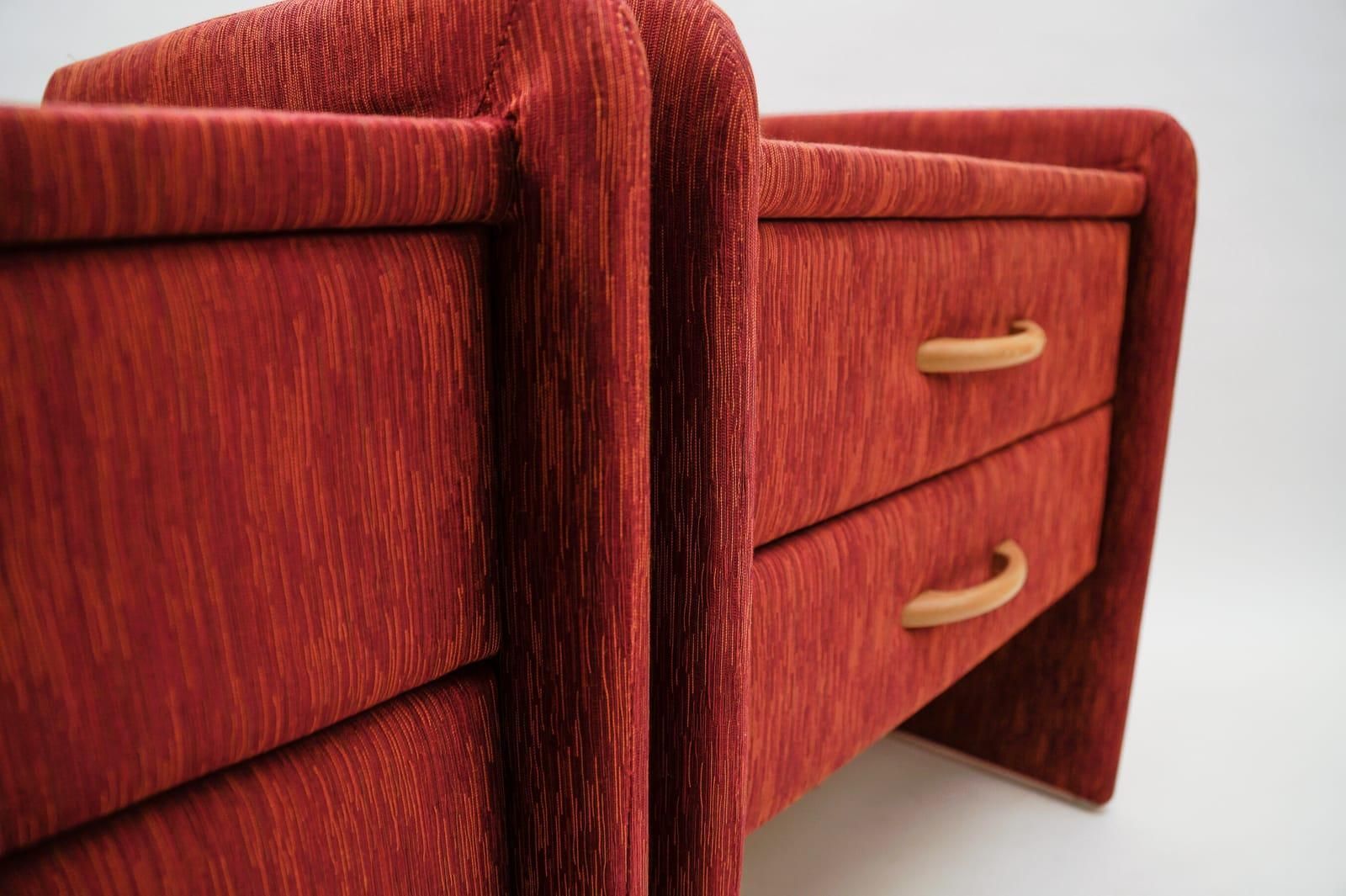 photo furniture Two Fabric Upholstered Bedside Cabinets In Light Cherry Red And Glass, 1980s