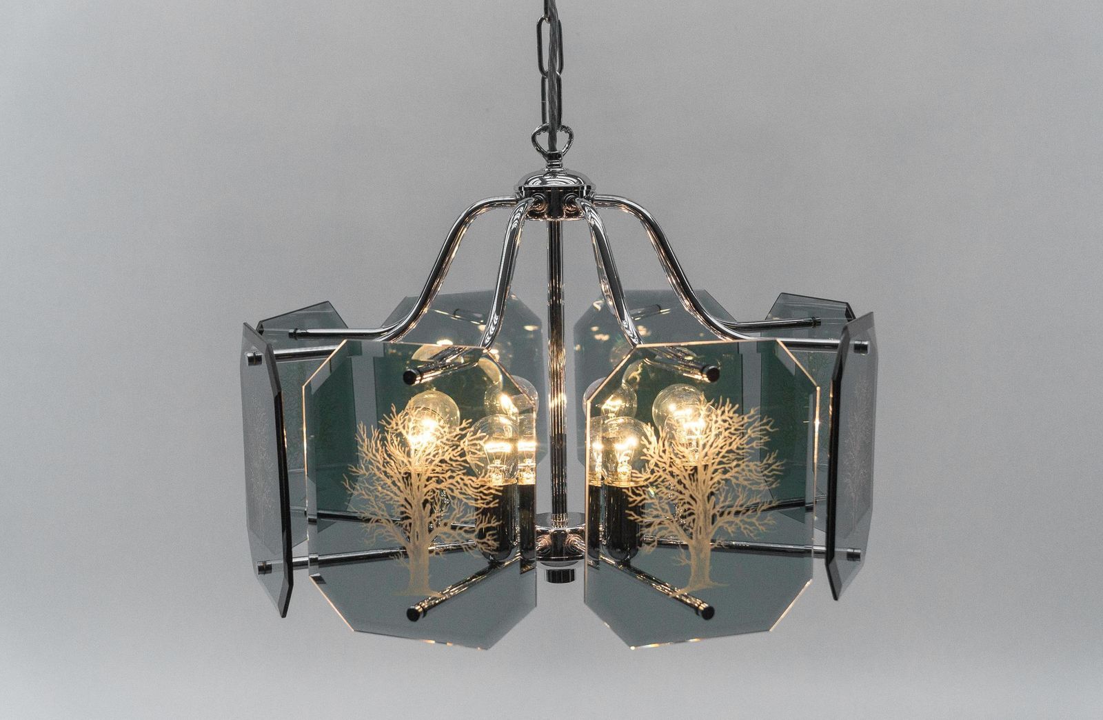 photo for sale Chandelier In Chrome With 8 Cut Glass Panes With Tree Of Life Motif, 1960s