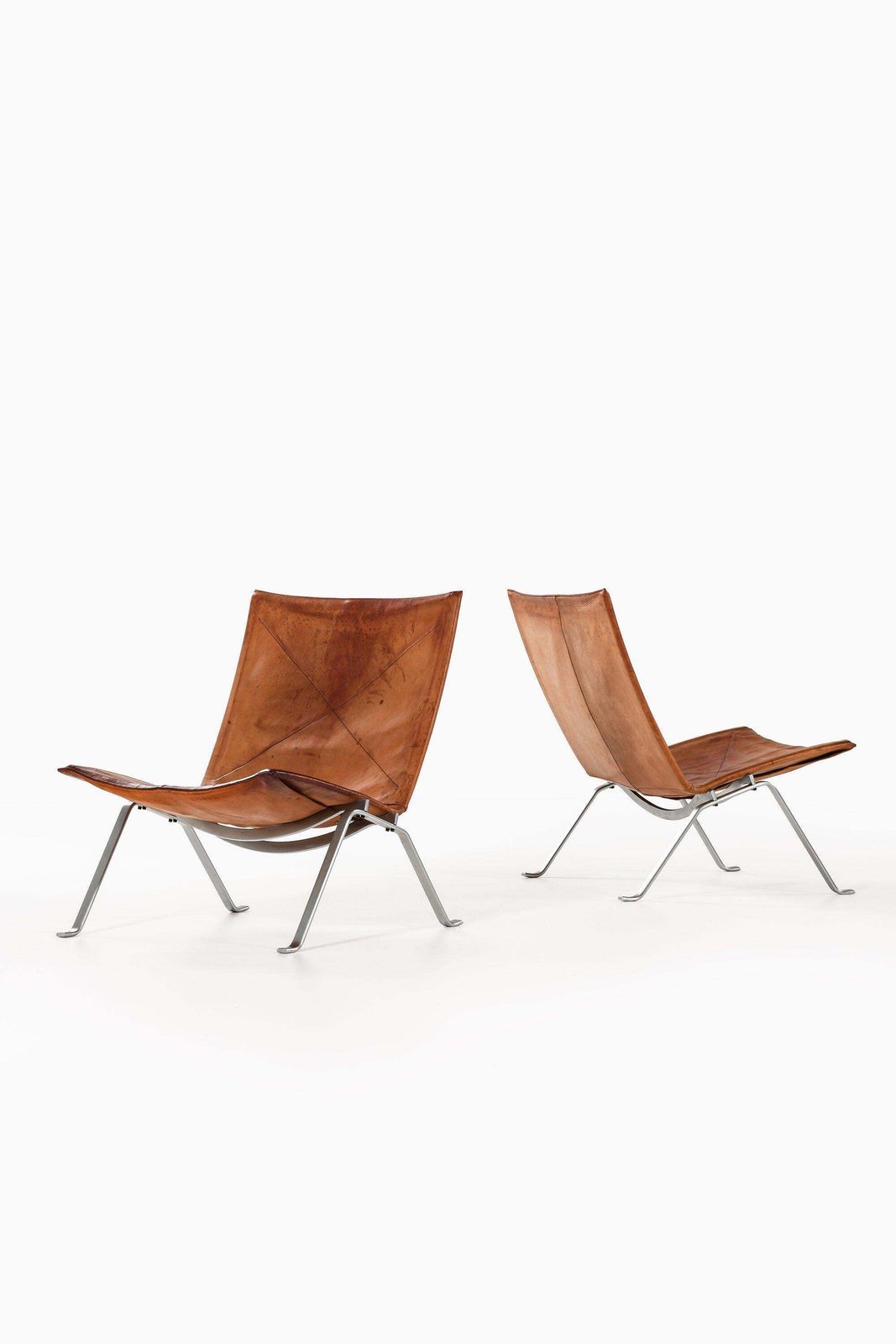 Pair Of Easy Chairs In Original Leather And Steel By Poul Kjærholm, 1950s photo furniture