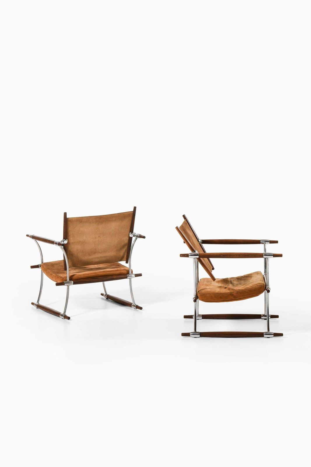 Pair Of Easy Chairs In Rosewood & Steel Frame By Jens Harald Quistgaard, 1960's photo for sale