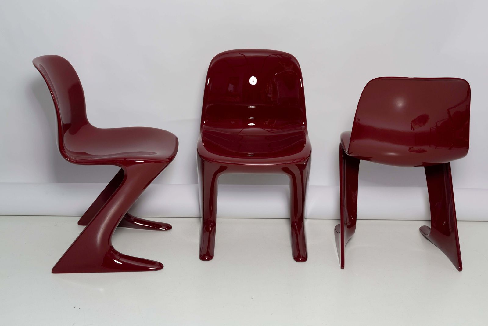 Set Of Three Red Wine Kangaroo Chairs Designed By Ernst Moeckl, Germany, 1968 photo vinterior