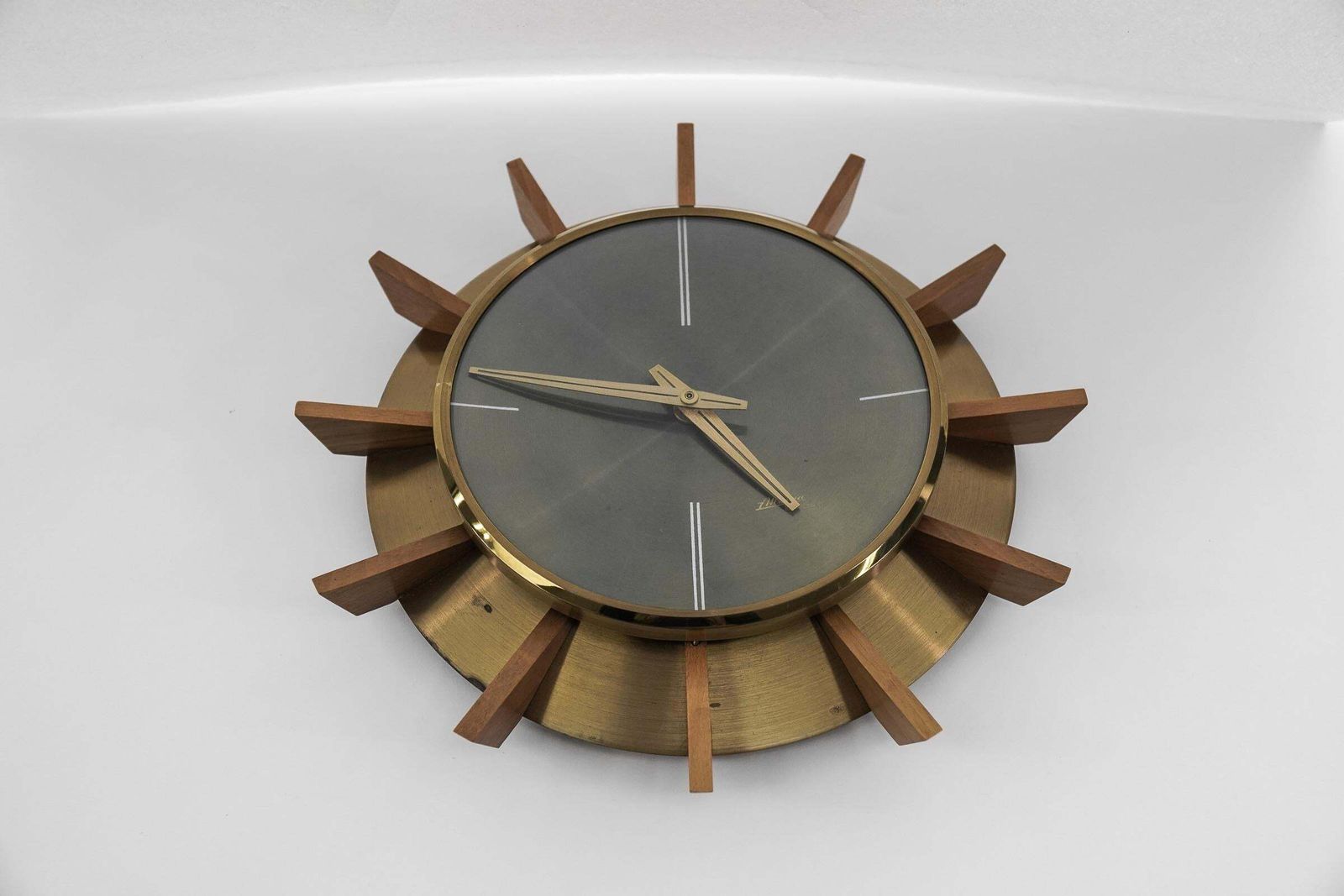 Mid Century Modern Brass And Wood Sunburst Wall Clock By Atlanta Electric photo furniture