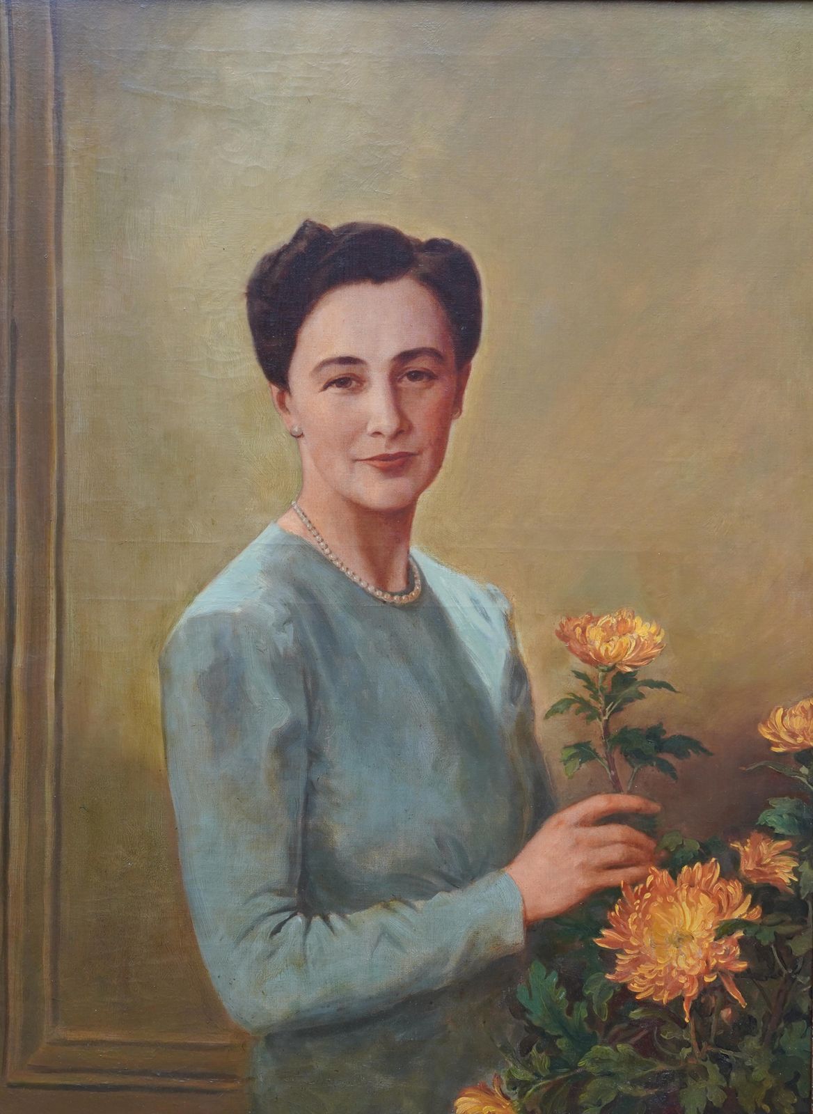 Portrait Of A Lady Arranging Flowers   British 1940's Art Oil Paintingcirca 1940 photo furniture