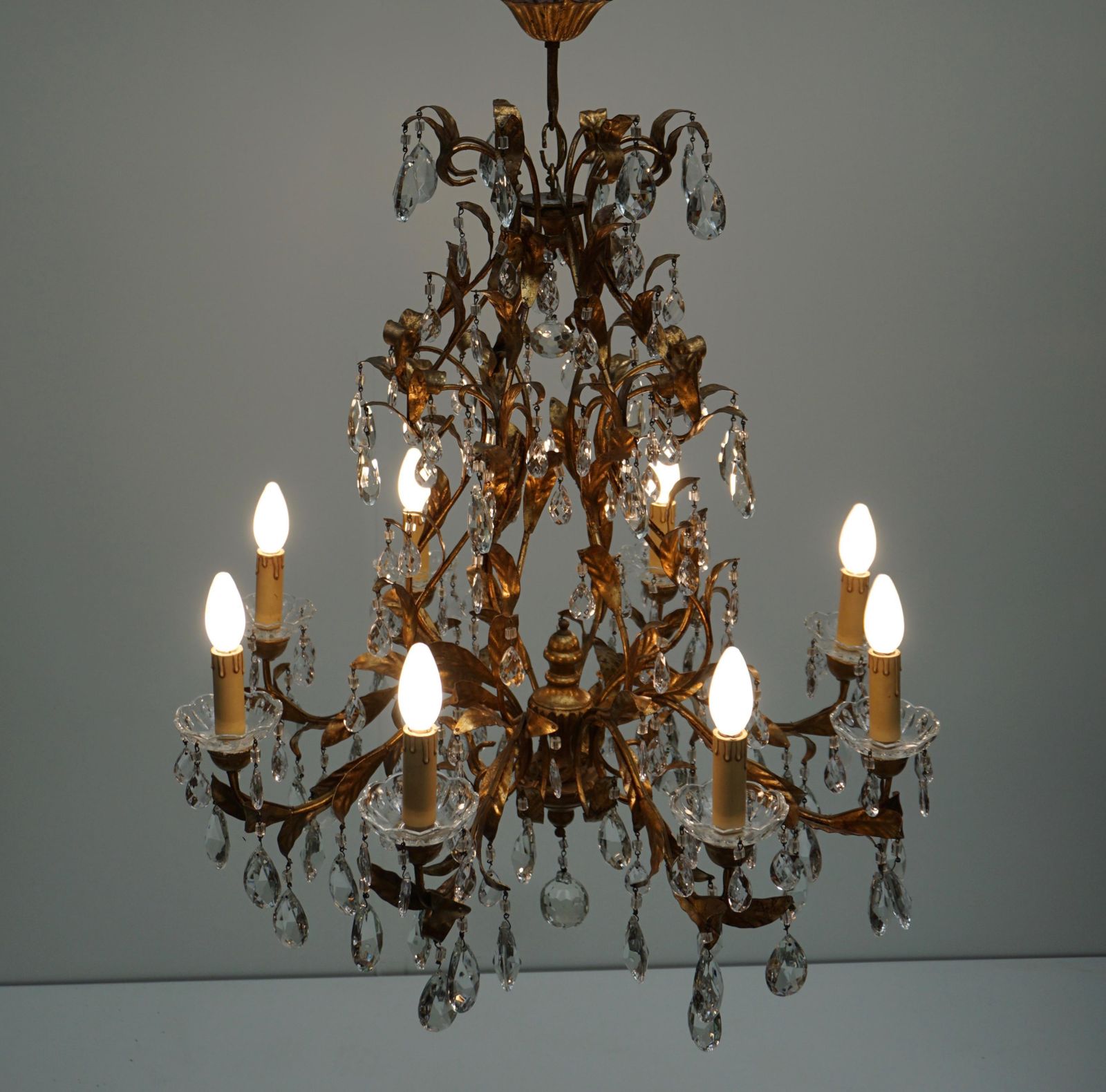 Gilded Brass Eight Light Chandelier With Leaves And Crystal photo for sale