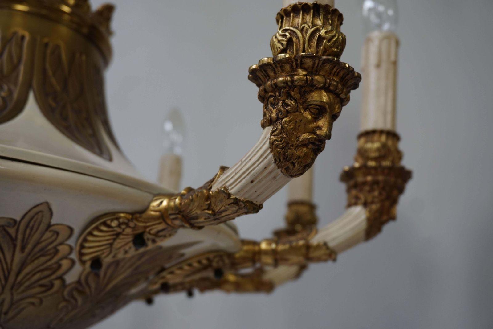 photo furniture Spectacular Ten Arms Brass White Painted Chandelier With Men's Head