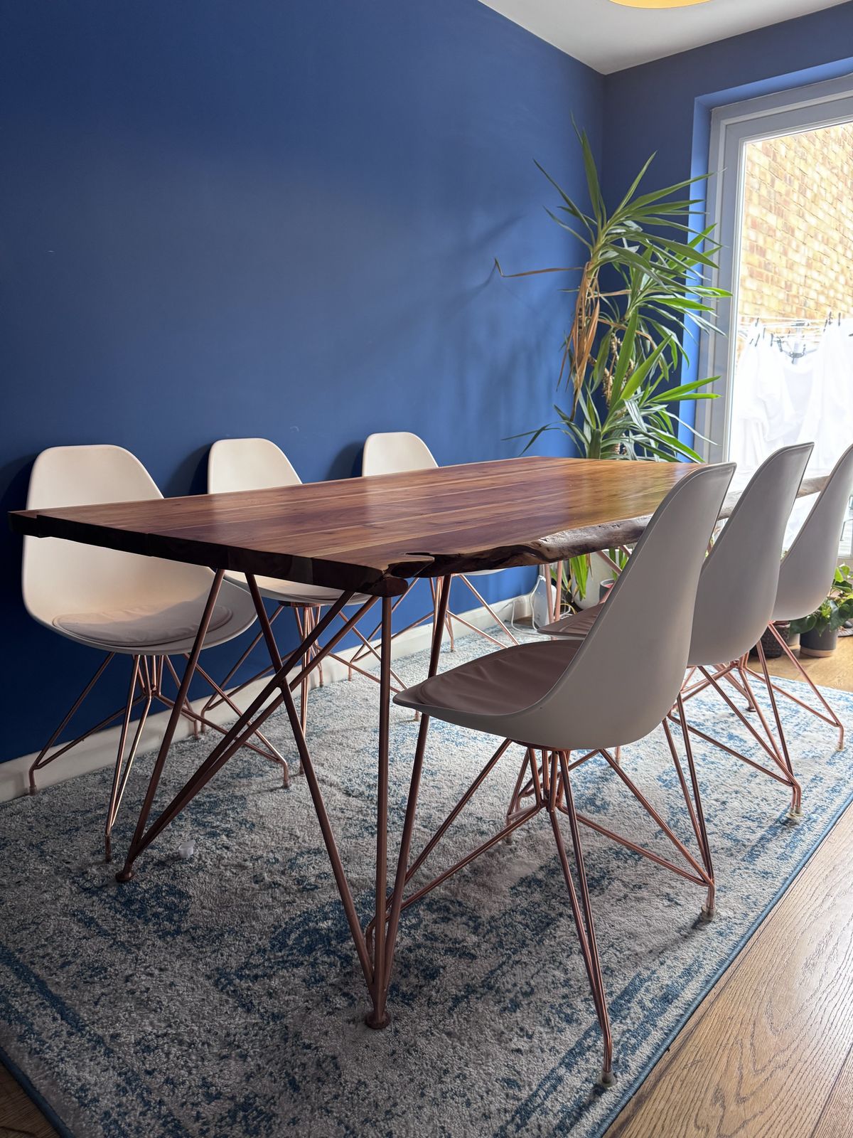 Modern White Molded Plastic Chair With Stylish Rose Gold Metal Legs