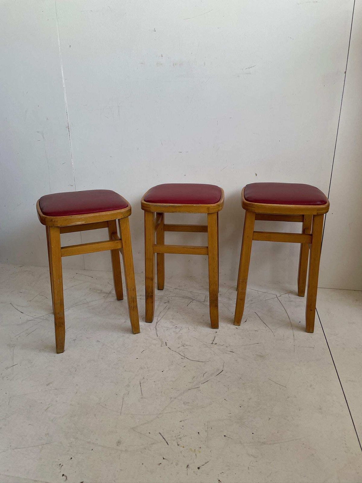 Set Of 3 Romanian Mid Century Wooden Stools With Red Vinyl Seats